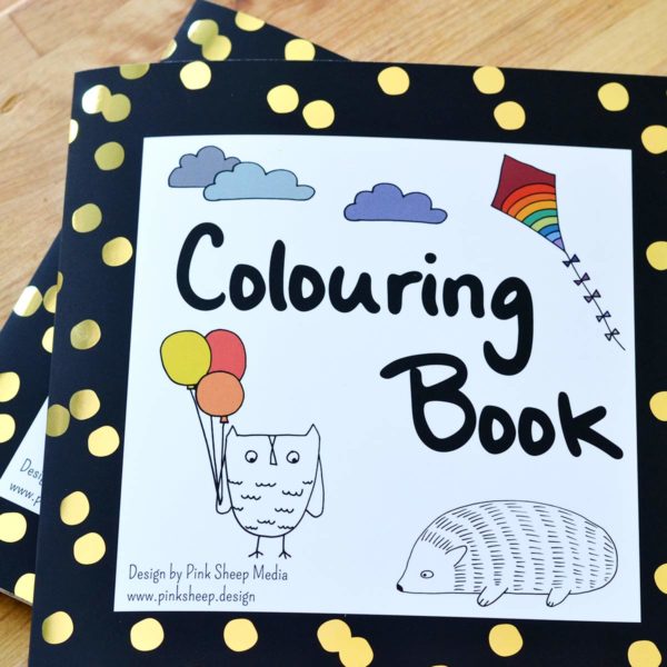 Colouring book cover black border with gold dots.